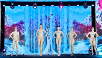 Создавая волну: Miss Grand Roi Et поднимает настроение сексуальными купальниками