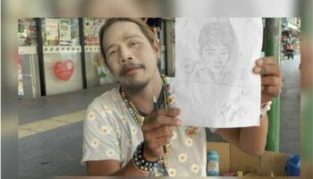 бывший тайский художник прославился, когда мылся посреди дороги (видео)